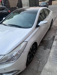 ازيرا 2014 • فول مواصفات • عدسات زينون