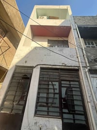 بناية استثمارية • الاعظمية شارع الضباط • ٦٦م واجهة ٤