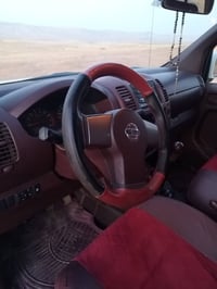 نيسان نڤارا • ٢٠٠٩ • تبريد وكهرباء