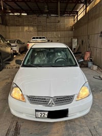 لانسر ٢٠١٠ • قير اوتوماتيك • سند لحد ٢٠٣١