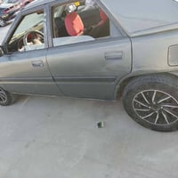 مازدا 323 • رقم نينوى • كير شرط