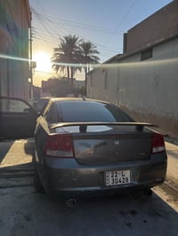 جارجر 2010  ماشيه 200 ميل  رقم اربيل بأسمي سنويه وهزه جديده لون نفطي ك...