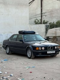 bmw 730 رقم بغداد باسمي كير مكينه حداديه خلفية واماميه كلها كفاله تبري...