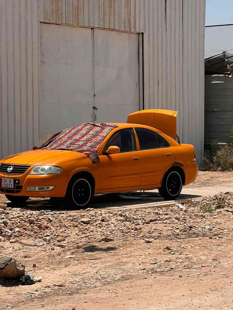 سلام عليكم نيسان صني مديل ٢٠١٢  بسمي رقم نكليزي مصفره هيه وغرامات تبريد ثلج منضومه جديده بيه جاملغ امامي مبدل بس وتلكيطات سعر ٧٥ رقم ***********  مكاني دوانيه حي الجزئر
