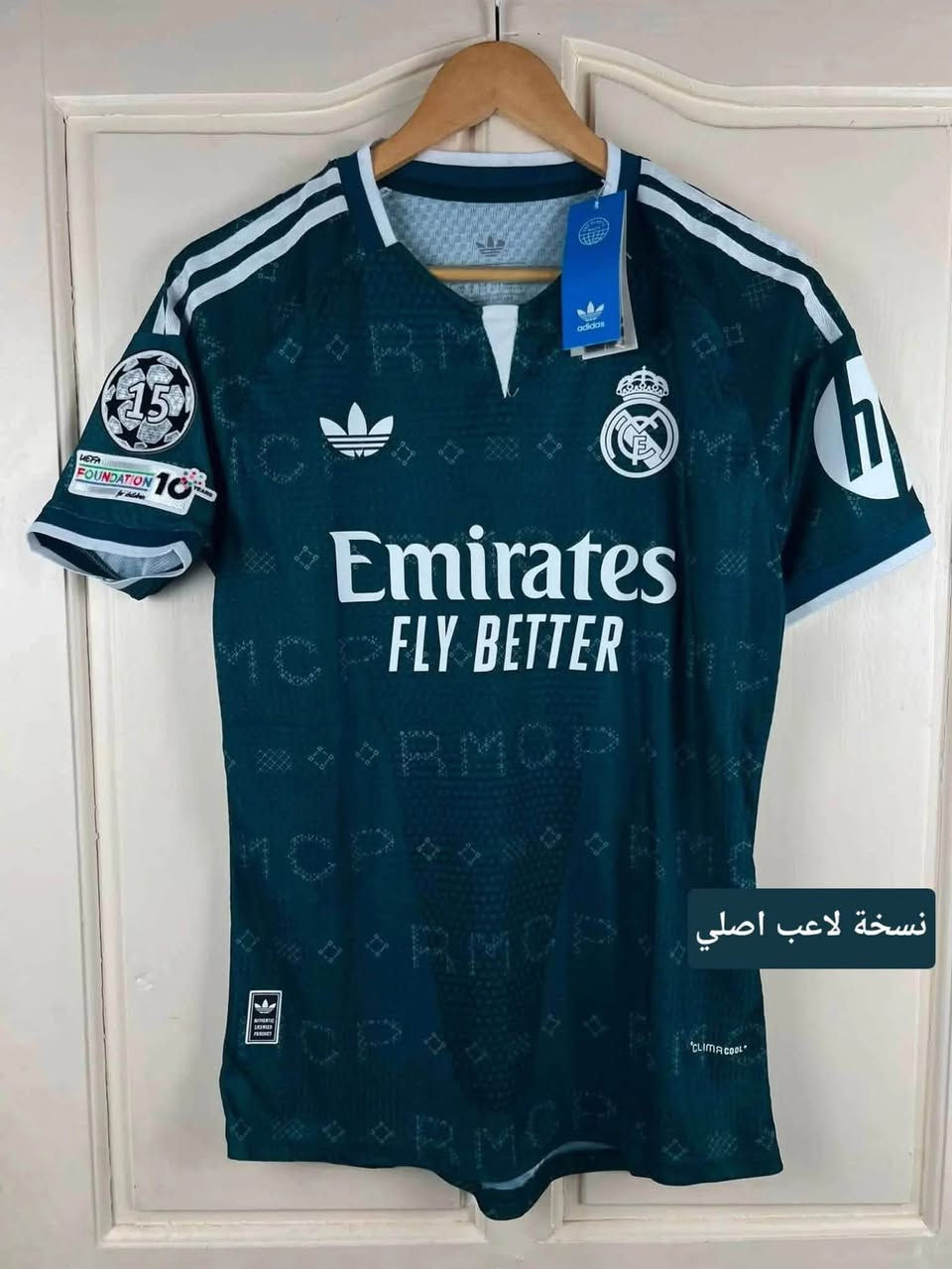 الاصلي
نسخة لاعب
شفيق للتجهيزات الرياضية

نص مكتوب في الصور:
- نسخة لاعب اصلي
- @footballjerseystore81
- N @nexgen_clothings