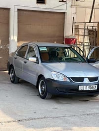 لانسر ٢٠٠٩ • محرك ٢٠٠٠ • رقم بغداد