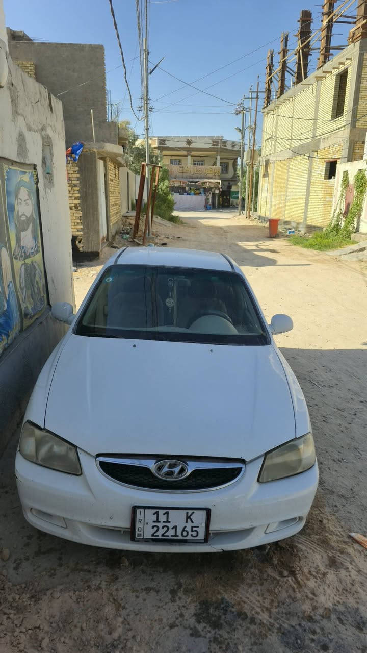 هونداي فيرنا مصبوغه  ضررها جاملغ ب اسمنه 2002  كير مكينه مكفولات سنويه جديده مكاني نجف ب 42 وبيها مجال***********
