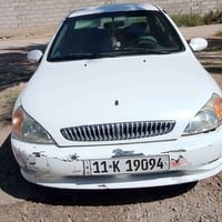 كيا ريو موديل2001رقم بغداد باءسمي سنوية نافذه لغاية2029اللون ابيض كبير...