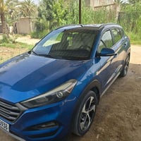 توكسان لون ازرق بغداد  موديل 2018 محرك  2400 تبريد قطعتين بصمه تشغيل و...