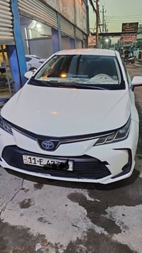 كورلا هايبرد. 2021  رقم بغداد باسمي  سونار مرفق مع الصور  وبيها حادث  ...