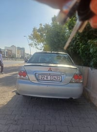 ميتسوبيشي لانسر • صبغ قطعة • سنوية ٢٠٢٩