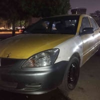 لانسر2010 حرة مصفره هيئه سعر45 كشرة تعبان للبيع مستعجل. 07716119528