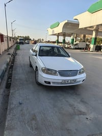 اخوان عندي نيسان سني ٢٠٠٥ ياباني للبيع رقم بغداد باسمي ( هزه + اراقام ...