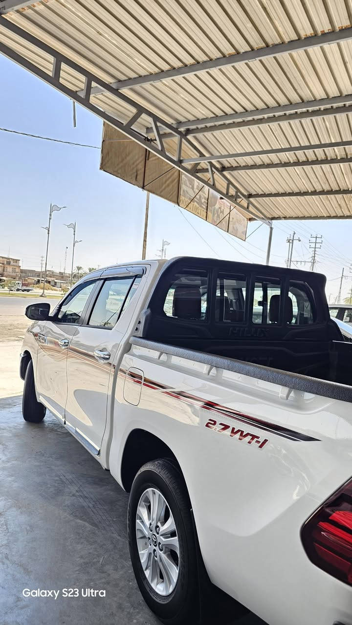 #معرض #الظلال المركزي 
بيك اب هايلوكس ناصي 2026
      🎗HILUX🎗TOYOTA
 🎈اوتماتيك  زيرو 🎈 
            وكالة SAS
⚠️الصيانه لمدة 3 سنوات او 100 
الف كم 
مرقم لوحات .أربيل  
 #موديل :2026

مواصفات : فول باب اول بلادي بدون أضافات أو سستم
المحرك : 2700vvt.i . V4
اللون : أبيض
المواصفات 
مرايا شفط #كهربائي/ 
#شاحن وايرليس
🎗 مفتاح التشغيل بصمه .
🎗كيلو متر  عداد🎀 لكزز🎀 مختلف كليآ
🎗بطايان ثانوية مغلفة شواصي 4اطارات
🎗 دفع ثنائي . 2×4.
🎗 مصابيح اماميه auto
🎗 كشافات ( بروجكتور) 
🎗 شاشه كبيره.
🎗 كامره دواره .
🎗 ويل كب قياس 16 
🎗 مقاعد بقلاوة تبريد أصلي المقاعد الأمامي  
🎗 زر مساعد نزول منحدر.
🎗زر مانع للتزحلق vsc قفل اكسل .
🎗 زر مساعد دوران dac .
🎗 سستم ايرباك متكامل .
🎗 شاحن واير لس .
🎗 مري AUTO قابله للطي.
🎗 اشاير بالمري .
🎗 ثلاجه وسطيه .
🎗 حساس خلفي 
🎗 مخرج للطاقه A 10  مخرج AUX&USB.
🎗مخرجHDMI L 
🎗 تحكم مقود متعدد لاستخدامات.
____________________________________
ملحقات السياره
🔖 فرشات ارضيات land cruiser prado
🔖 صندوق اسعافات اوليه 
🔖 مطفأة حريق 
🔖كيج ايطارات 
🔖 مثلث
🔖 عده 
🔖 جك 
🔖 سبير نوع ويل كب 
🔖كتيب ضمان والصيانه
🔖بصمه اضافيه
🔖نفاضه
 🦅معرض ألظلال المركزي 🦅

اي استفسار عن طريق الاتصال  أو الواتساب فقط 

واسط الصويرة شارع المعارض الرئيسي 
***********    واتساب

***********    واتساب
