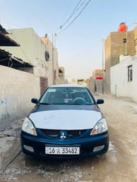 لانسر ٢٠١٠ • مكينة جديدة • كهرباء شغالة