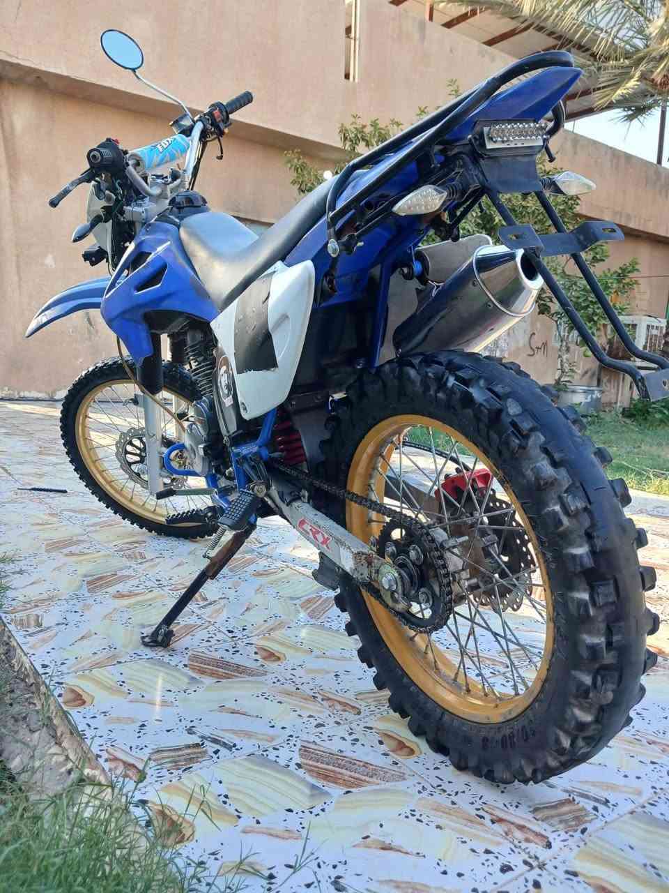 للبيع دراجه قفاز CRX حجم المكينه 300cc موديل 2023الدراجه نضيفه ولدراجه ممفتوحه الدراجه نقصهة بريك خلفي ودشلي مال سلف مسحوك يرادله تبديل رخيص هسه اني اشغلهة دفعه هيه تشتغل هندر بس مكينه جبيره الهندر يرجع عليه قوي بس دفعه اشغلهة بس تبديل دشلي الدراجه ترجع نكره تخبل شلعه سرعه فول خير من الله مبينه بالصور نضيفه وخير من الله  السعر 900 وبيهة مجال قليل حك الجيه المكان ديالى الاستفسار ***********
.
