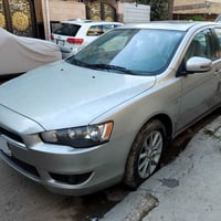 للبيع لانسر قرش 2016 خليجي استلام شركه 2023  ماشيه 39 الف فقط رقم بغدا...