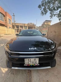 كيا K4 موديل 2025 لون اسود  رقم بغداد داخلة بكتاب شهداء بعد الها سنة و...