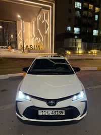 كورلا هايبرد • فتحة سقف • جلد قرميدي