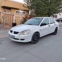 لانسر ٢٠٠٨ • بدون بويه • الرخصة لحد ٢٠٣٠