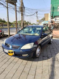 لانسر ٢٠٠٩ • اوتوماتيك • رقم بغداد