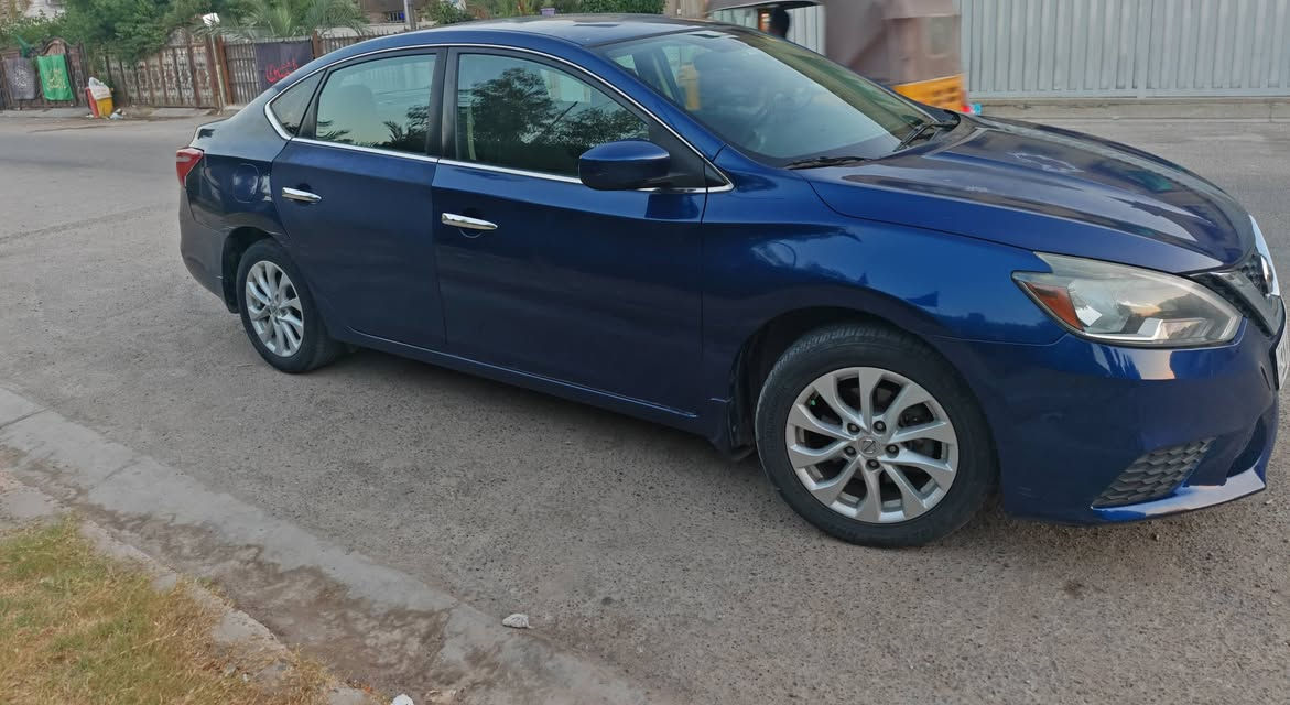 نيسان سنترا 2019 (SV)  وارد أمريكي .. رقم بغداد
المواصفات:
🔹 المحرك: 1800cc
🔹 المسافة المقطوعة: 106 ألف كيلو 
🔹 الشاشة والكاميرا: بلادية الأصلية
🔹 الأنظمة: رادار أمان + مثبت سرعة (Cruise Control) 
🔹 وباقي مواصفات فئة SV المعروفة 

​🟥 الحادث:
🛠️ الحادث خلفي: الجاملغ الأيمن الخلفي والباب الخلفي مصبوغات…  صور الحادث مرفقة مع المنشور 
🛡️ الأيرباك: سليم 100% (ما طاك).
🛠️ تعديل بارد: بالجاملغ الخلفي الأيسر.

🟥 ​الملاحظات :
 جرود  بالبنيد والقمارة.
 ضعف بكمبريسر التبريد (التبريد شغال لكن برودته ضعيفة).
🟥 ​حالة السيارة العامة:
السيارة نظيفة جداً وعلى إيدي، إدامة مستمرة أول بأول، استخدام بنزين محسن وأفضل أنواع الدهن. الكير والمكينة بحالة ممتازة جداً .. سنوية وهزة جديدة لحد 2030 . 

​📍 المكان: بغداد - البلديات
 السعر: 97 ورقة وبيها مجال 
📞 رقم التواصل: ***********
