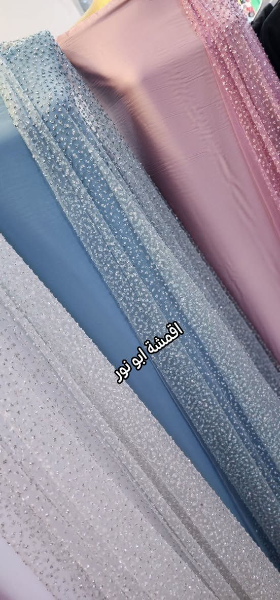 أعزائي الزبائن الكرام بفضل الله وصلت ارقى وأجمل الموديلات 🆗️🆗️
زي كوردي عرايسي كرستال مميز وراقي
 خاص للمناسبات والاعراس 💯💯
أرخص الأسعار وأفضل الماركات 
اقمشة ابو نور البزاز & جمله و مفرد 
خانقين مول ***********

نص مكتوب في الصور:
- اقمشة ابو نور