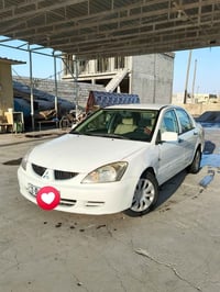يا الله لانسر موديل 2010 المرغوب  السياره مكفوله فقط تعمير اهلالات رقم...