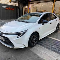 كورلا هايبرد ٢٠٢٥  ماشية ٤٠ الف  السيارة بأسمي  بالصورة الاخيرة اكو ضر...