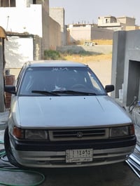 مازدا ٣٢٣ • ١٩٩٢ • كويسينجاك