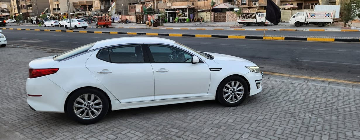 السلام عليكم أوبتما للبيع 2014شكل 2015المجموعه الدوليه معروفه مواصفات الدوليه محرك 2000دوش مكفول من الفتح والتبخير والتنقيص سياره بيها الجاملغالخلفي بالهلال بارد ومصبوغ الجاملغ والباب الخلفيه فقط مفتوح سنترتت براغي موضوح بالسونار بالصور مواصفاتها تبريد قطعتين جلد تحكم ستيرن جهتين فول شاشه كاميرا خلفيه توقف ذاتي يدات نيكل 4دسكات  وباقي المواصفات المعروفه السعر 135 وبيها مجال بسيط مكاني بغداد الرقم ***********
