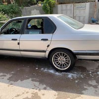 بي ام 735i • رقم بغداد • جلد اسود ملكي