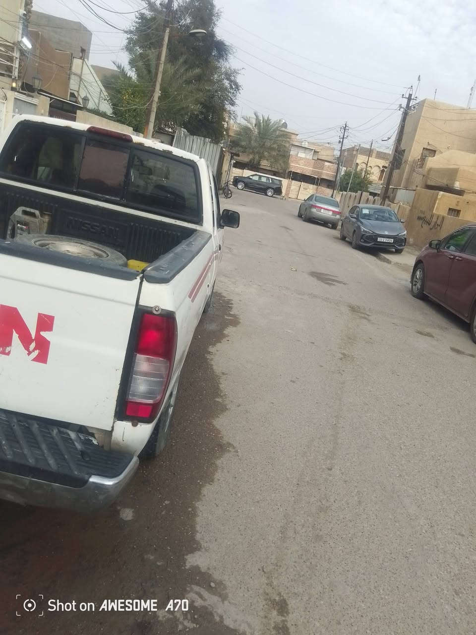 عندي بيكب نيسان 2000 كير اوتو بلاد تعليك محرك ونجي 6 سلندر بيه جراد مصبوغة صورته الاصابع موجودة مال الجراد حزام تبريد تخم تاير رقم بغداد سنويه لل28 بأسمي مكان السيارة بغداد نفق الشرطه واتس اب***********

نص مكتوب في الصور:
- Shot on AWESOME A70