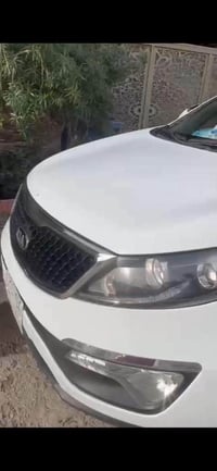 سبورتج 15 للبيع خليجي محرك 2000 بغداد  ابيض  مكفولة ماعدى شبر بالباب ا...