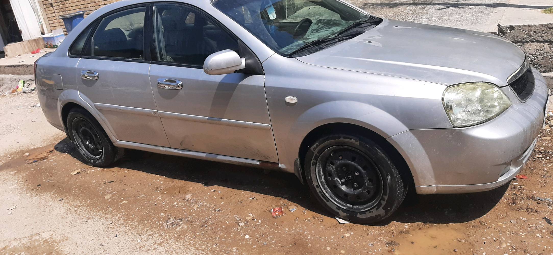 فورنزا موديل ٢٠٠٧ مكينه وكير خير من الله تبريد شغال السياره بسمي تحويل ثاني يوم السياره عوزه صبغ فقط والصدر الخلفي ٥٠% مكاني بغداد ***********
