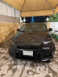 لانسر قرش خليجي GT فول. 2009  بصمه تشغيل + ابواب + جنطه  فول تحكم ستير...