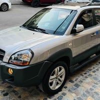 عندي توكسان ٢٠٠٩ رقم بغداد تحويل ثاني يوم سياره جديده وجاهزه على ايد و...