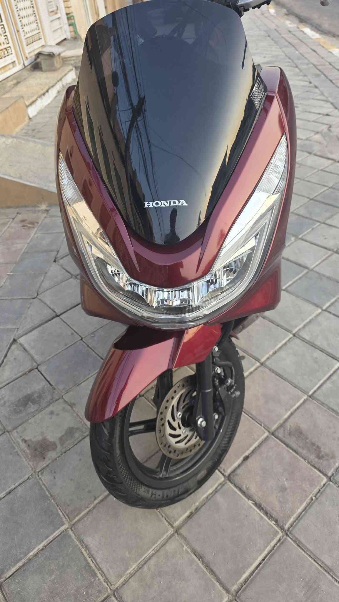 السلام عليكم PCX جيل ثاني 🇯🇵 ياباني
‏​⚙️ المحرك: 150CC
‏​🎨 اللون: ماروني مميز ❄️.  
‏ماشية 18الف وبل يابان ماشية 14الف 
‏سويجات العدد 2
‏مواصفات
‏كامرات اجت بيهة من 🇯🇵اليابان✅
‏تدفئة بل يدات ✅
‏حساس ازدحام ✅
‏حساس استان ✅
‏الدراجة ورقة المزاد مالتهة وصور اليابان وتقريرهة  مالتهة موجود    
‏🛠️ الدراجة: مكفولة    
‏​​📍 الـمـكـان: بـغـداد :الشعب 
‏📱 لـلـتـواصـل والإسـتـفـسـار: (‪***********‬) 
‏

نص مكتوب في الصور:
- HONDA PCX150 Inspected Sold Starting price 0 ¥ 0 ¥ Final price 196 000 ¥ 112 000 ¥ Cost calculation Price in yen 112 000 ¥ Finish price in yen 000 000 ¥ Calculate Overall rating 4 Year of registration 2016 Mileage 14 567 km Mileage history 0 km Displacement 150 cc