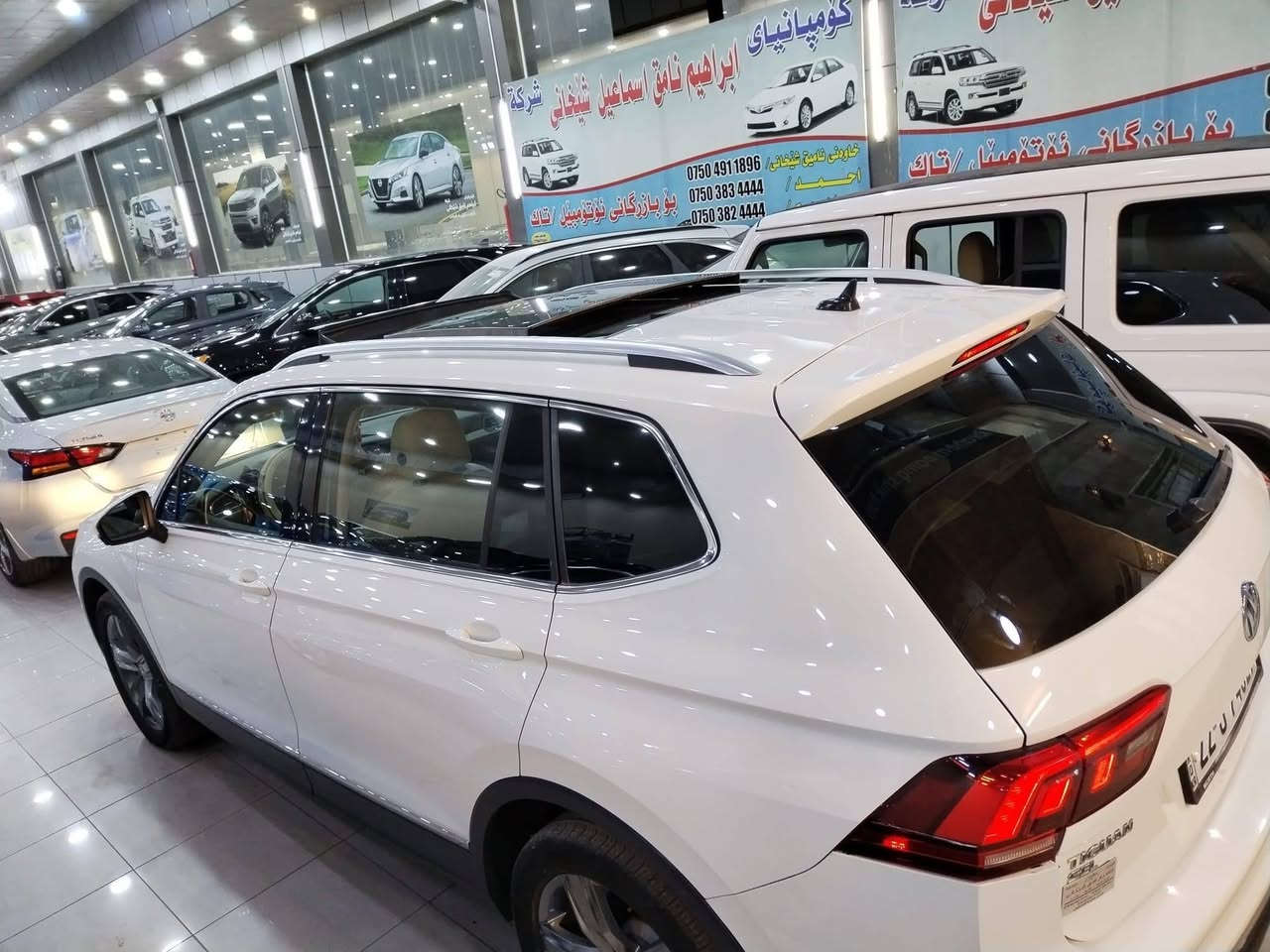 فولكس واكن تيكوان موديل 2020 

عدد المقاعد (  7  )

عداد المسافة : 80  ml

حجم المحرك : 2.0L TURBO ( 4 سلندر 

المواصفات :sel  
فول بانوراما 

كيج الكتروني 
 ابواب بصمة
بصمة تشغيل 
تشغيل عن بعد (Remote Start)
شاشة دشبول ديجيتال
شحن وايرليس
كاميرة
‏‎تحديد سرعة
اوتو ستارت Auto Start
اوتو ستوب Auto Stop‎
رادار جانبي  (نقاط عمياء)
رادار خلفي (التحذير من الاصطدام)
حساسات امامي
حساسات جانبي 
حساسات خلفي 
نظام : Eco
نظام : Normal 
نظام : Sport
كشنات جلد
كشنات كهربائي
كشنات دفئة
تبريد لمس
تبريد مركزي 
لايتات ليد عدسة زينون بيلادي
بكلايتات ليد بيلادي 
ويل كروم
بعد هواي مواصفات… رقم اربيل بااسمي 
العنوان  دهوك / عقرة
‏‎للاستفسار اكثر الاتصال علی هذا الرقم 
***********
***********
