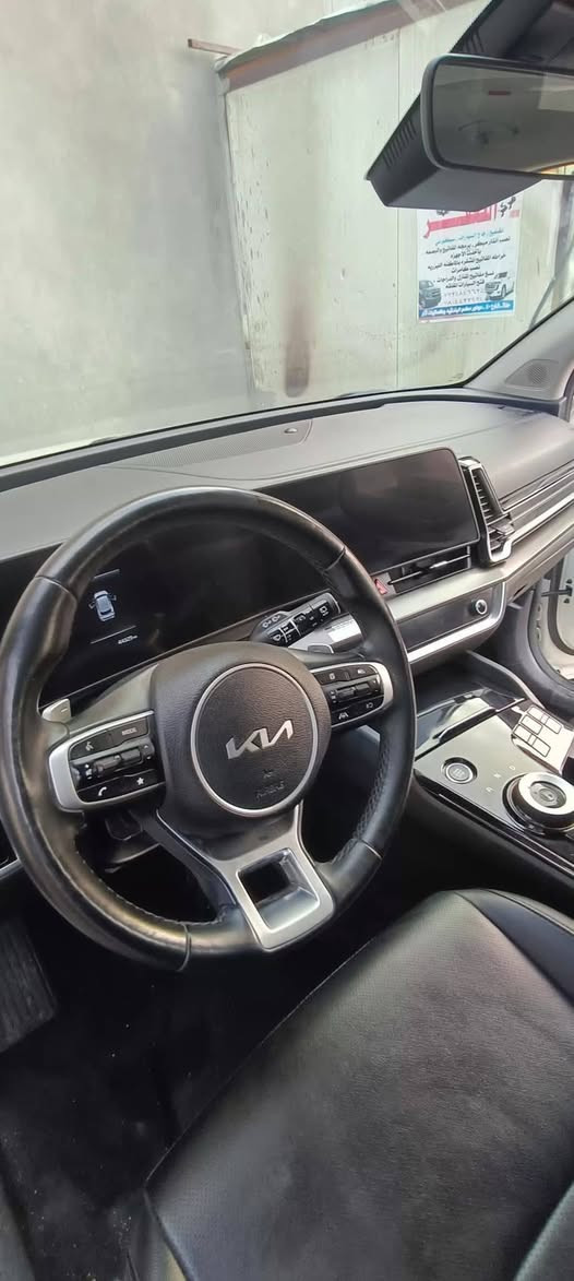 #سبورتج  هايبرد|KIA Sportage
 - موديل 2023  
مرقم بغداد شبه مميز 57155
  مواصفات 
فور ويل  4x4
 محرك 1.6 لتر توربو هايبرد بقوه240 حصان (اقوى من جميع اصدارات سبورج واكثرهن اقتصاديه وعمليه)
 ‏تمشي بتفويله وحده 950km
 ‏#العداد 45 الف mi 
 ‏#حادث_السيارة بنيد وجاملغ
صبغ بنيد بدون اي تبديل 
ليبل واحد
 ‏#اللوحات بغداد شبه مميزة
 ‏#اللون ابيض
كير ماوس اوتيماتك 8 سرعات
تشغيل ذكي ( بصمة ) ,تشغيل عن بعد
شاشة Apple CarPlay, android auto 
تحكم ستيرين كامل مع تدفئه 
هاند بريك كهرباء
 شاشة كبيرة ( GPS )
 رادارات 360 
حساس خلفي
 
شاحن وايرليس
كرسي كهرباء 
تدفئة المقاعد الامامية
تدفئه مقود 
 هاند بريك كهرباء 
 مانع انزلاق 
 اوتو هولد ( AUTO HOLD )
 مساعد نزول المنحدرات 
 سستم صوت مميز
 ‏انظمه قيادة متعدده
 ‏نظام قيادة ذاتي
 ‏كشنات جلد فاخر طبيعي
 ‏منافذ USB +أواكس
للستفسار ***********

