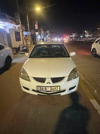 لانسر 2007  مكينه 1500  السياره باسمي رقم بصره مشروع وطني وين ما تريد ...