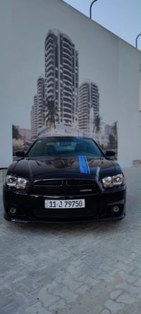 دوج جارجر Mopar edition 2011  لون اسود وخط ارزق بلادي  ماشيه ٢٢٤٣٠٦ كي...