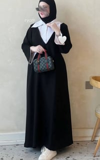 ما لبست • أسود • شوية جبيرة
