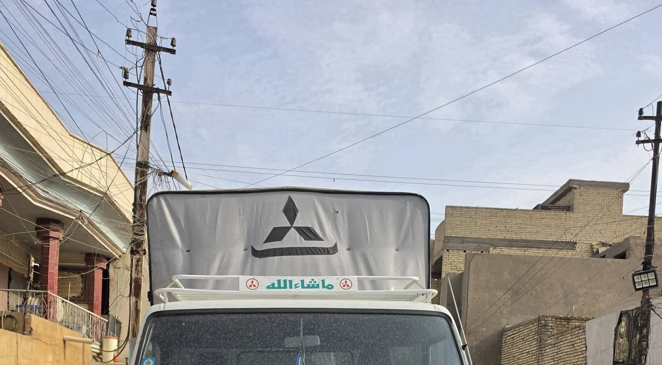 جاكيت مطري • مكاني بغداد