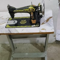 مكينة خياطة • الميز • دواسة