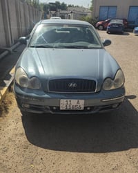 سوناتا وفود موديل 2005 محرك 2000 الي فلوس قليل ياخذها  رقم بغداد ألمان...