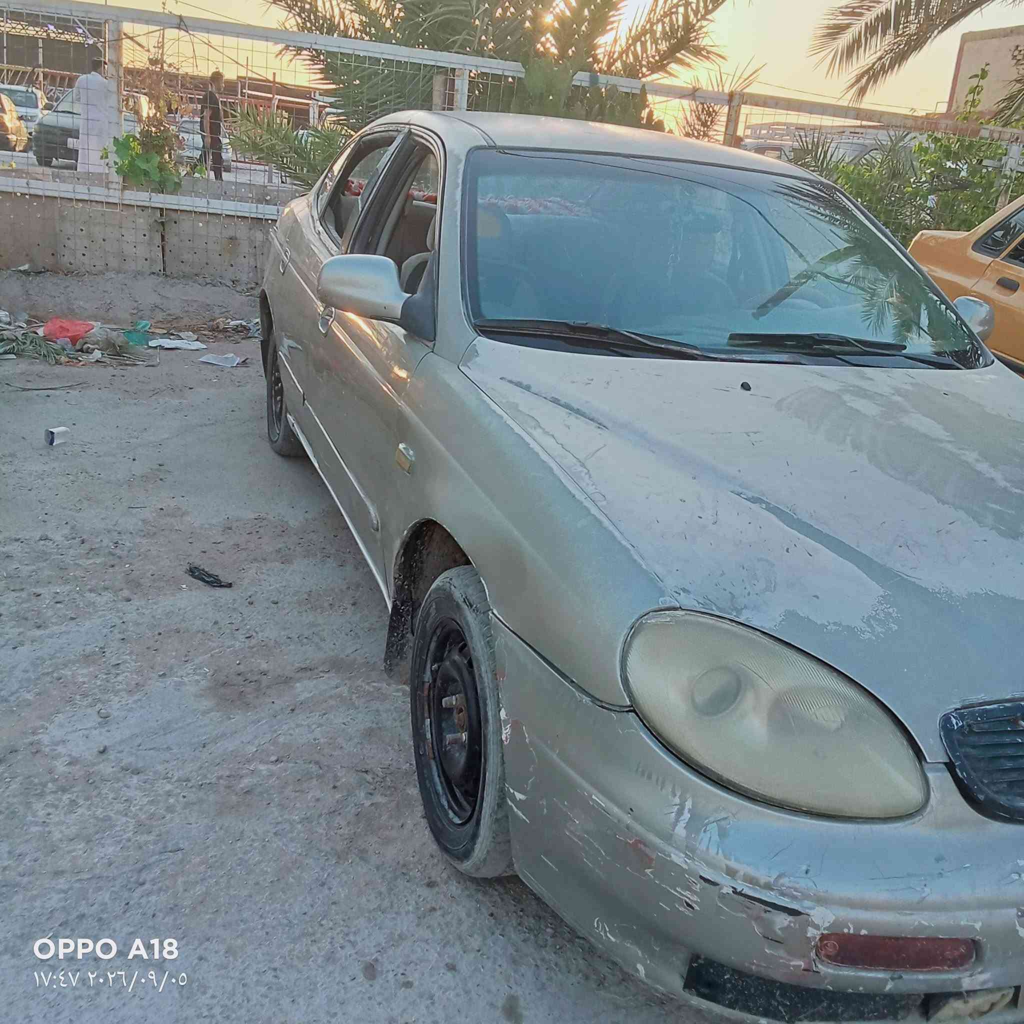 سيارة دايو لگنزا موديل 99 محركها محور گير ومكينه كورلا رقم بغداد مالك السيارة نجف ناحية العباسية مكان السيارة نجف ناحية العباسية 
السعر 20 ورقة وبيها مجال 
للاستفسار الاتصال 
***********

نص مكتوب في الصور:
- OPPO A18
- ١٧:٤٧ ٢٠٢٦/٠٩/٠٥
- ١٧:٤٦ ٢٠٢٦/٠٩/٠٥