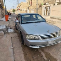 كيا اوبتيما • ٢٠٠٠ • مكينه كورلا