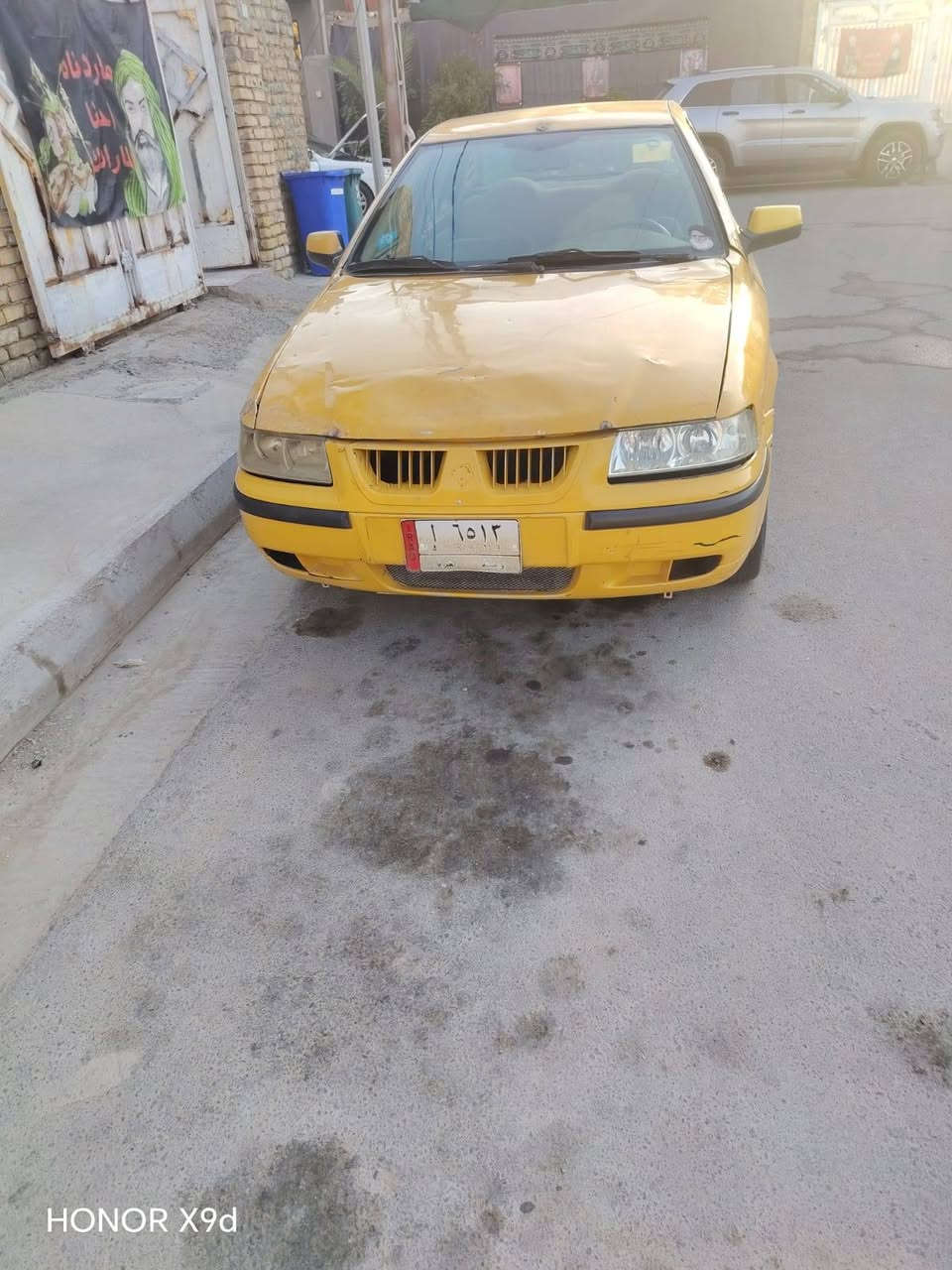 سياره سمند للبيع سعر14ورقه مداور مكاني كوت سياره خير من الله مكينه كير حداديه خياس معمر 
رقم راعيه ني مكلف. ***********

نص مكتوب في الصور:
- HONOR X9d