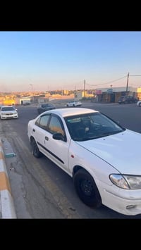 صني ٢٠٠٢ • محرك ١٨٠٠ • رقم بغداد